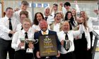 Arbroath and Carnoustie Band members celebrate with musical director Neill McDonald (centre). Image: Supplied