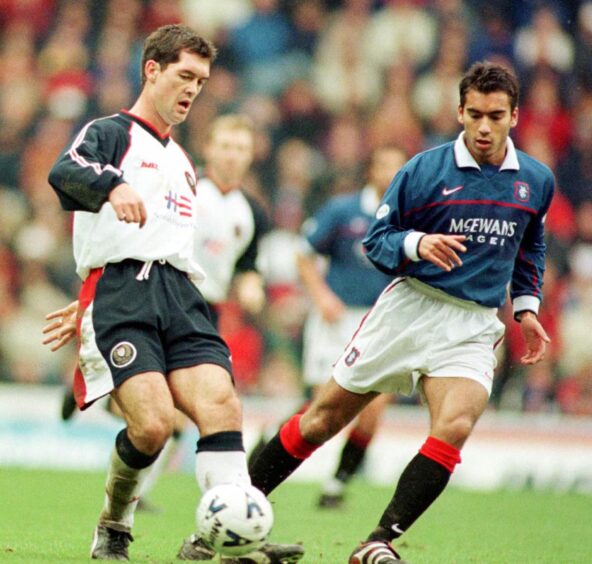 Willie Falconer in the change kit while playing against Rangers. 