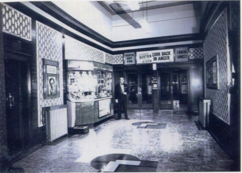 Alhambra manager Robert Morrison ready to welcome guests in the foyer in 1959. 