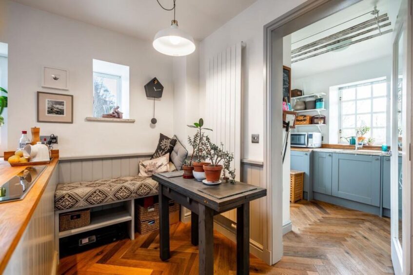 A utility room sits off the kitchen.