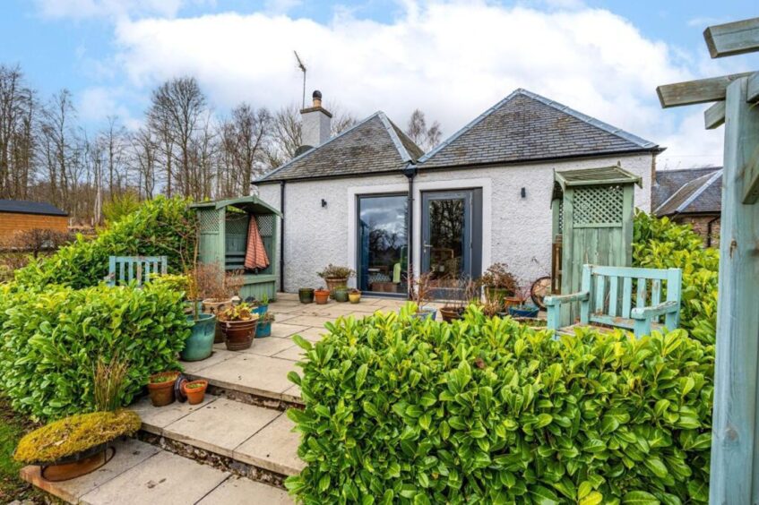 Patio doors lead to the garden.