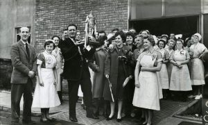 Jock Steinwith hospital staff when he took the Scottish Cup to West Fife Hospital in Dunfermline in 1961.