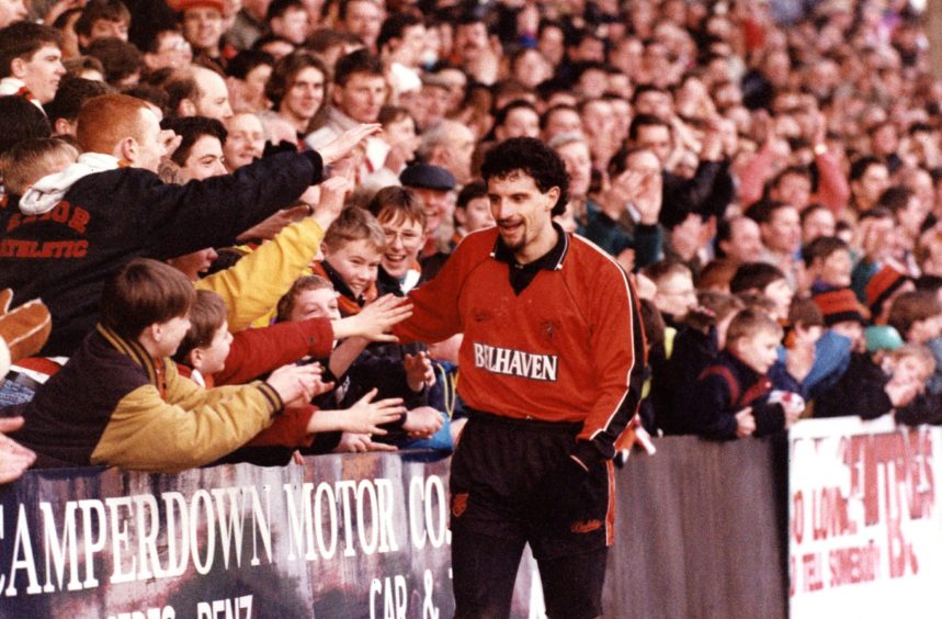 United striker Victor Ferreyra celebrates with fans in January 1992.