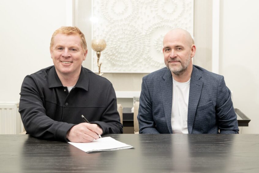 Neil Lennon signs his Dunfermline deal alongside chief executive and chairman David Cook