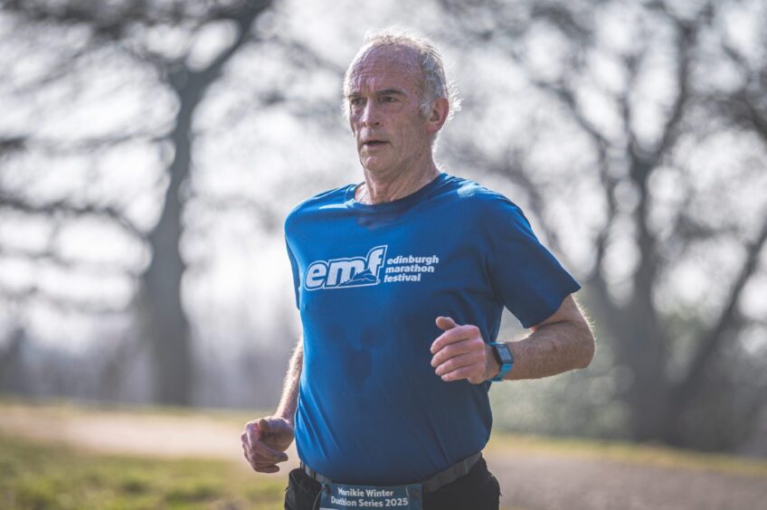 A runner stays focused during the Winter Duathlon at Monikie Country Park