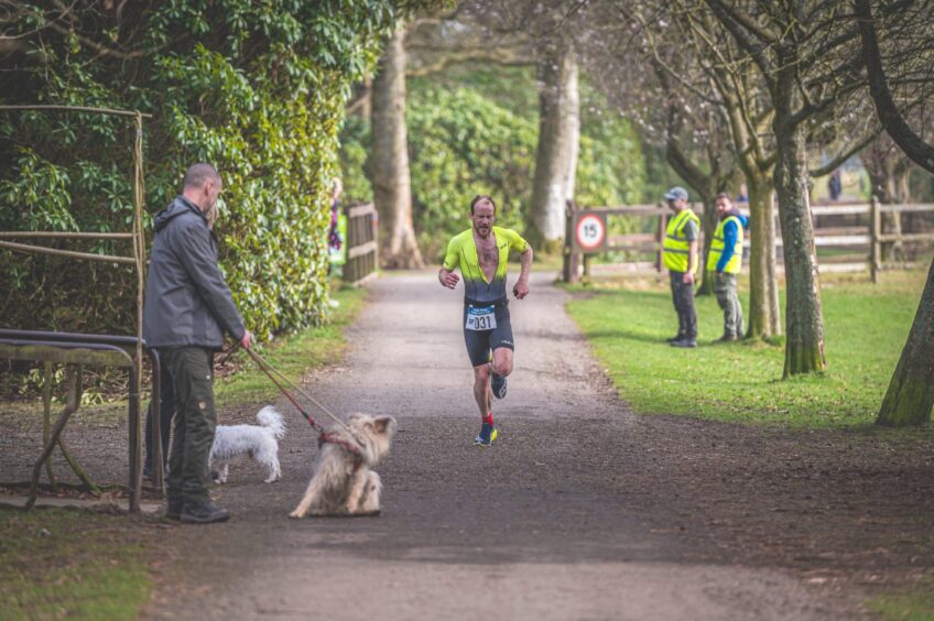 Spectators watch on at the finish line.