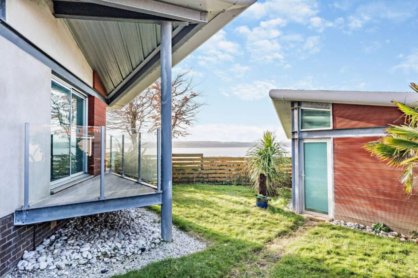 A smaller rear balcony sits off the master bedroom. 