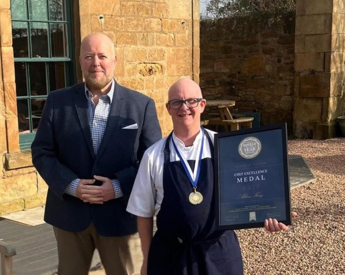 Alan Kay is presented with his Chef Excellence Medal.