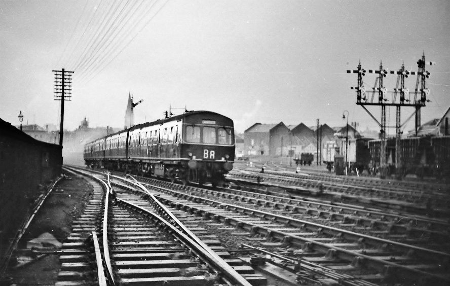 a black and white shot showing a DMU with a Carnoustie train at Camperdown Junction in 1961