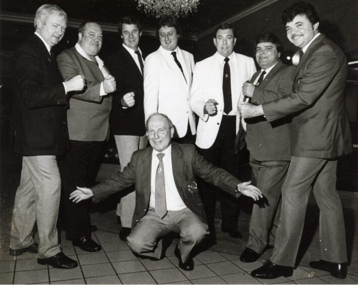 Jocky in a suit before a home international in Aberdeen in 1985. Also in the picture are Leighton Rees, Eric Bristow and John Lowe.