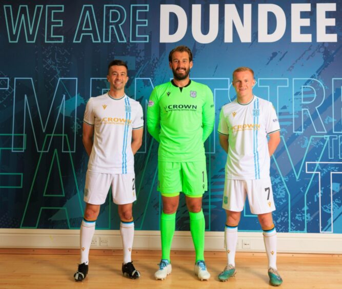 three Dundee FC players model the 2023-2024 away kit