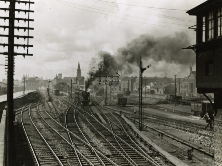 Camperdown Junction with Dundee East in the background in April 1953, steam is billowing from a train coming down the track