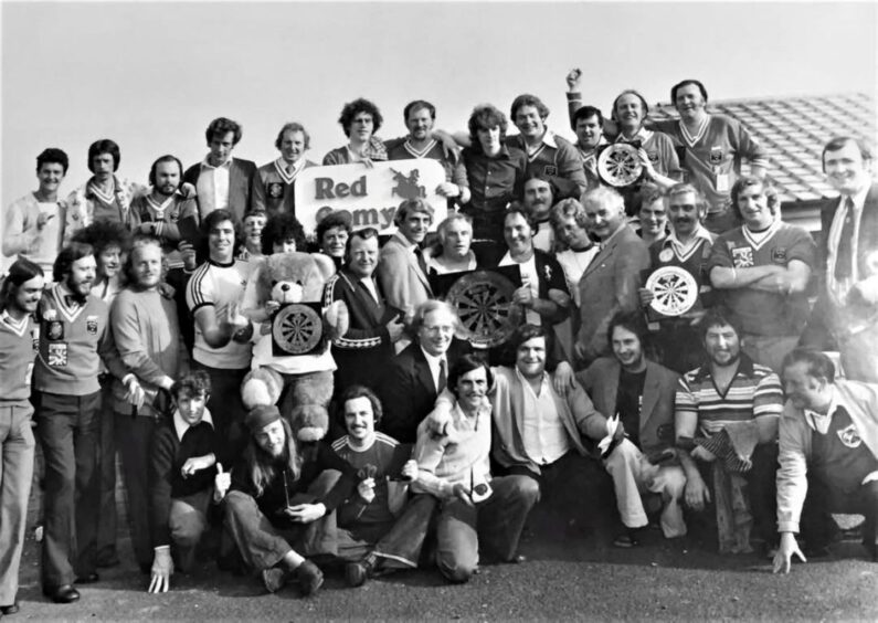 a group shot of Jocky and team-mates celebrating the 1978 Evening News win at Kelty