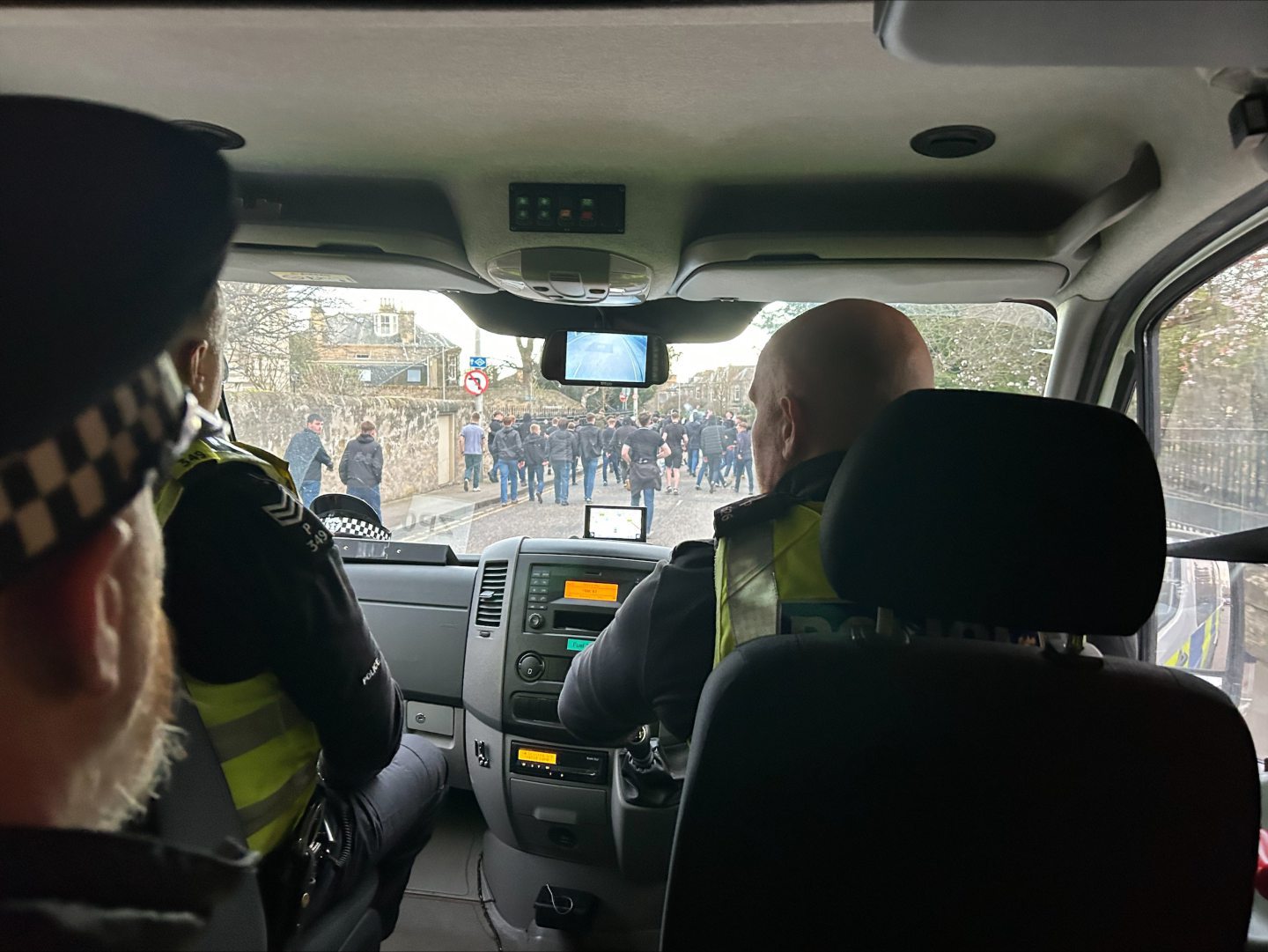 Police escort Dunfermline fans int Kirkcaldy town centre.