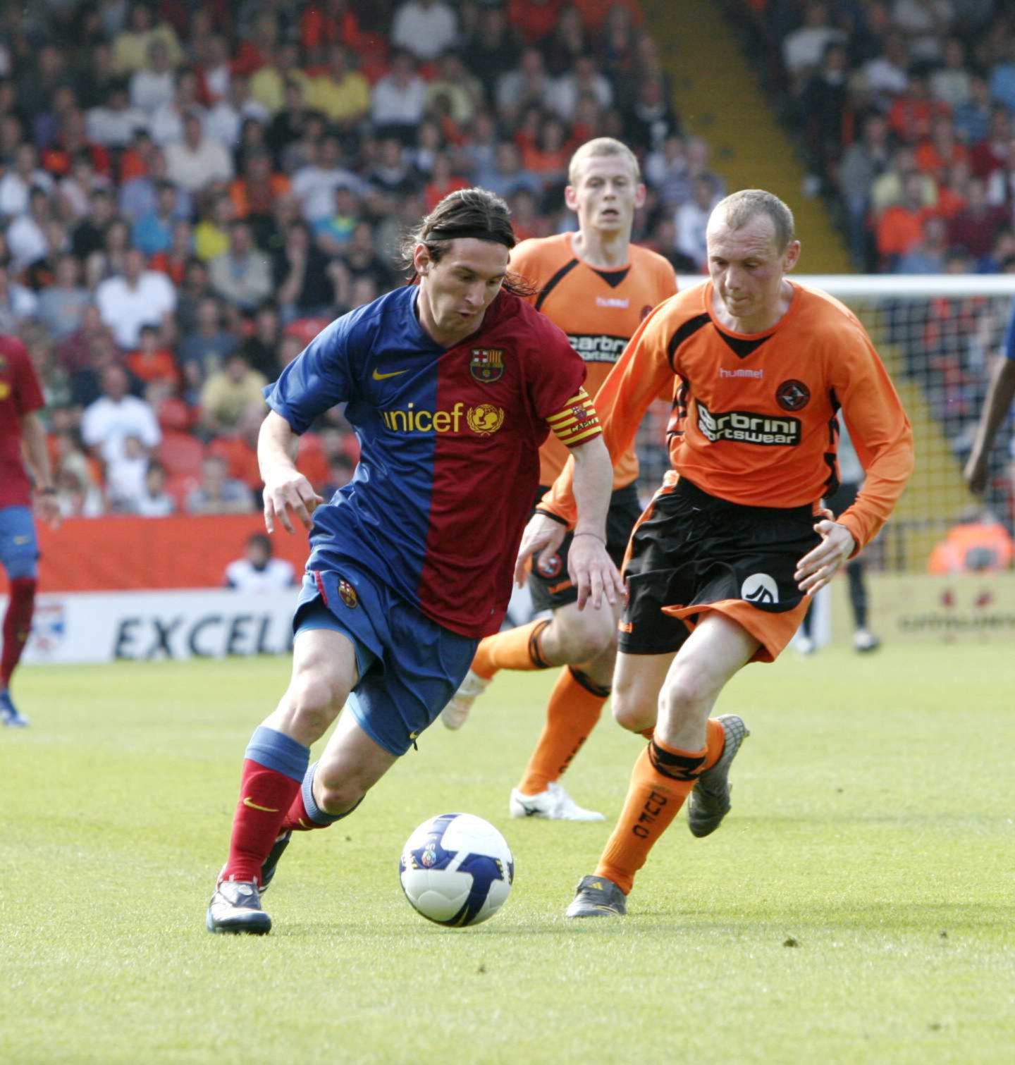 Willo Flood up against Lionel Messi in a friendly match