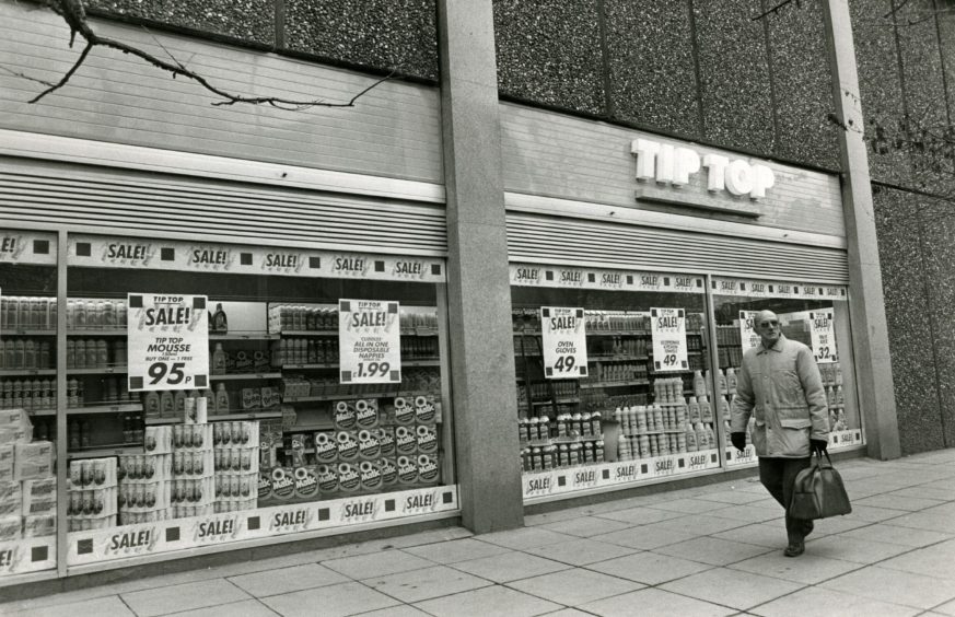 a man walks by the outside of Tip Top in the Overgate in 1987.