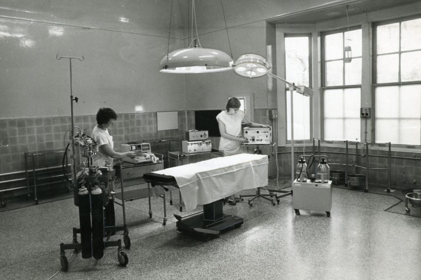 two workers inside the operating theatre at Fernbrae Hospital