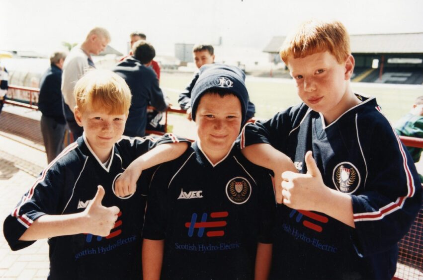 Three young fans in the new Dundee shirts in 1998.
