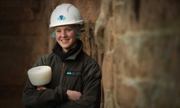 Apprentice stonemason Sarah Tebbs at Arbroath Abbey. Image: Historic Environment Scotland