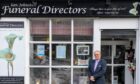 Ian Johnston in front of funeral directors