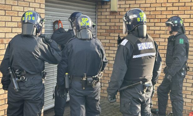 Police raiding an industrial unit on Crompton Road in Glenrothes. Image: Neil Henderson/DC Thomson