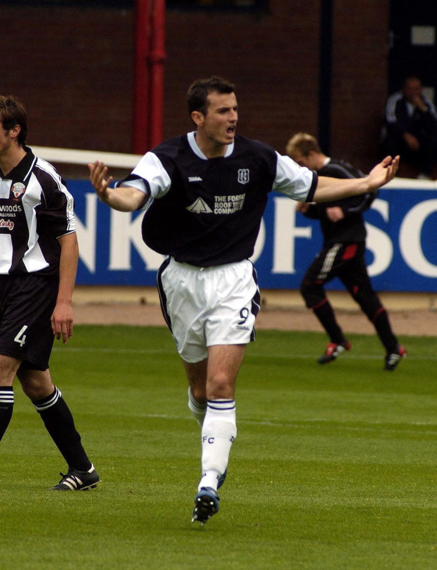 Simon Lynch celebrates after scoring for Dundee FC