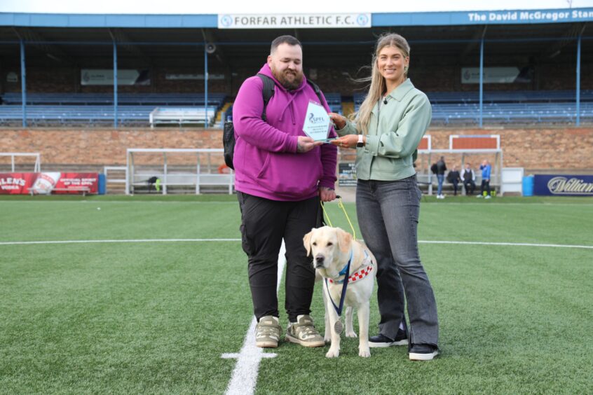 Jon Attenborough and guide dog Sam were presented with awards by the SPFL’s Molly Hyde in September. 