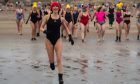 150 women celebrate International Women's Day with a sunrise dip at West Sands Beach, St Andrews. Image: Kim Cessford / DC Thomson