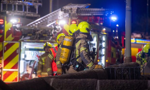 Firefighters at the scene of the Forfar house blaze. Image: Kim Cessford/DC Thomson