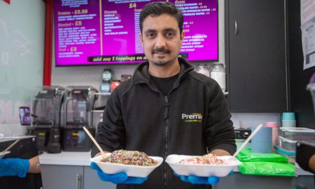 JP from Hayats Supersave serving up the new 'shredded' ice cream. Image: Kim Cessford/DC Thomson