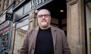Novelist Russel D. McLean standing outside the Waterstones on Dundee's Commercial Street where he used to work.