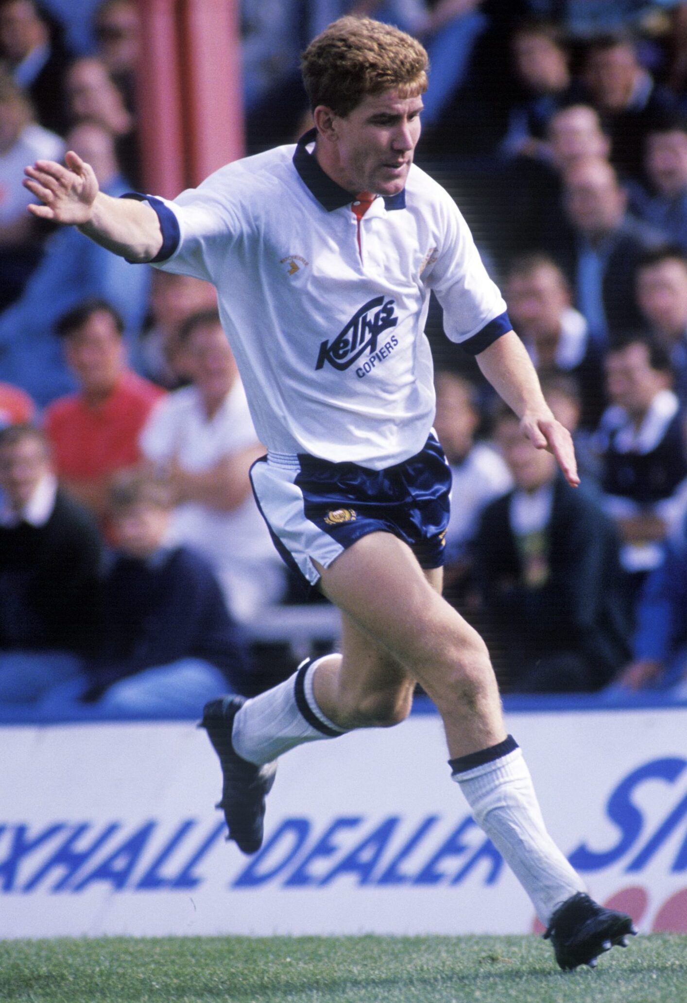 Keith Wright prepares to kick the ball while playing in the change white kit