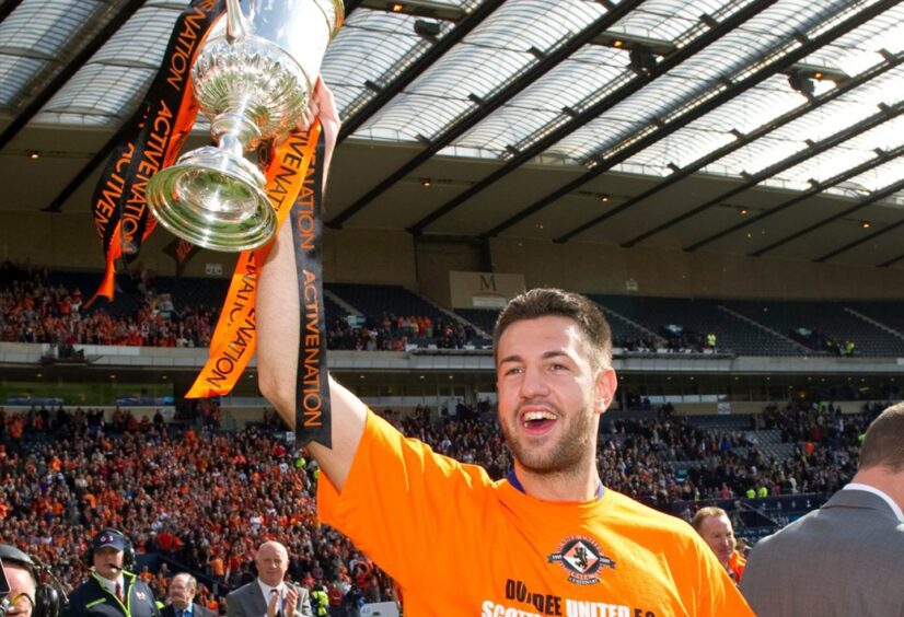 Mihael Kovacevic holds the Scottish Cup aloft for Dundee United