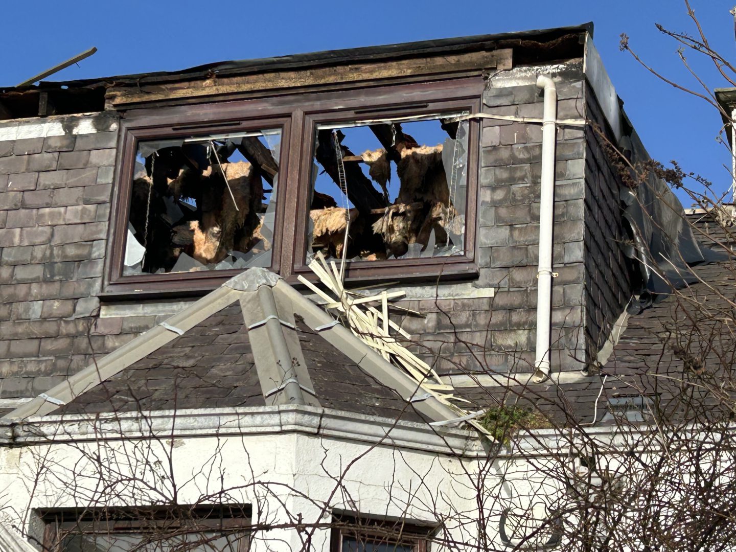 Extensive damage to the upper floor of the house.