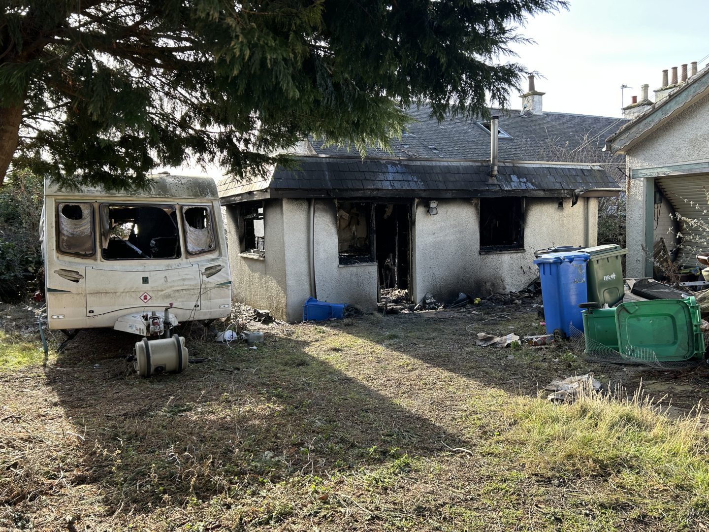 A caravan was also destroyed in the fire.