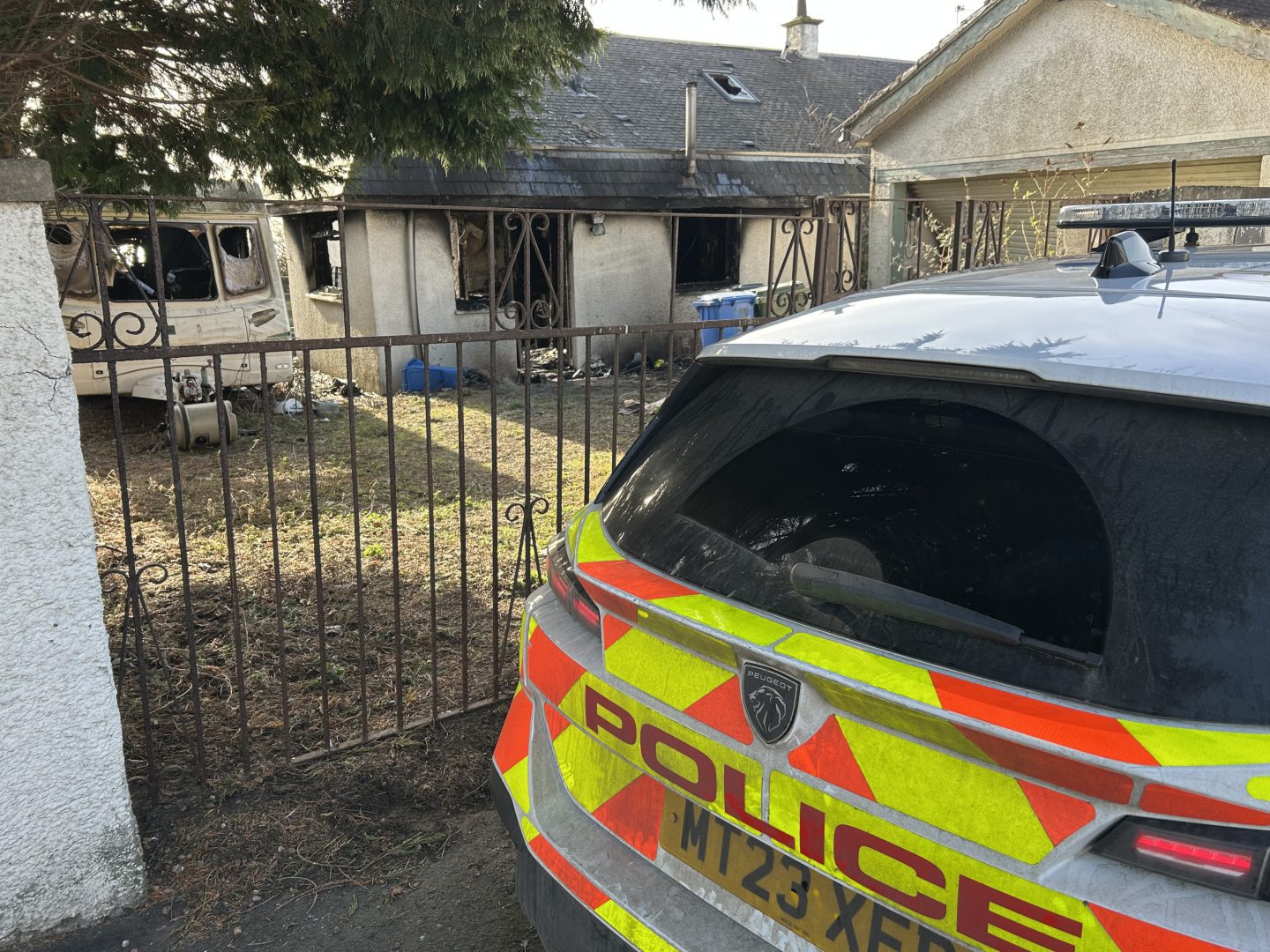 Police remain at the scene 24 hours on from the fire.