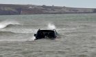 Car in sea near Lunan Bay, Angus.