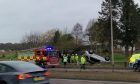 The car on its roof on the A90. Image: Andrew Robson