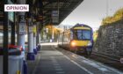 A woman had to be rescued by paramedics after falling down the gap between the train and the platform at Dundee. Image: Mhairi Edwards/DC Thomson.