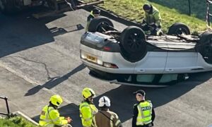 The car being towed away after crashing into gardens on Pentland Crescent in Dundee. Image: Supplied