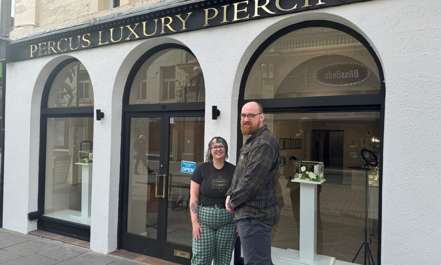 Gregg and Claire outside the shop.