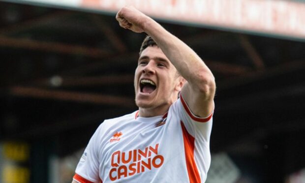 Ross Graham aims a fist-pump at the Dundee United fans