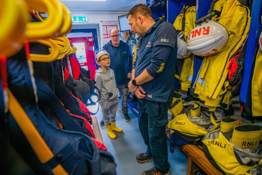 AJ Jamieson and dad John talk to Anstruther lifeboat coxwain Michael Bruce