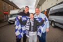 Mia McKenzie (aged 10) with dad Scott McKenzie (left) and grandad Alan McKenzie (right) Image: Steve MacDougall/DC Thomson