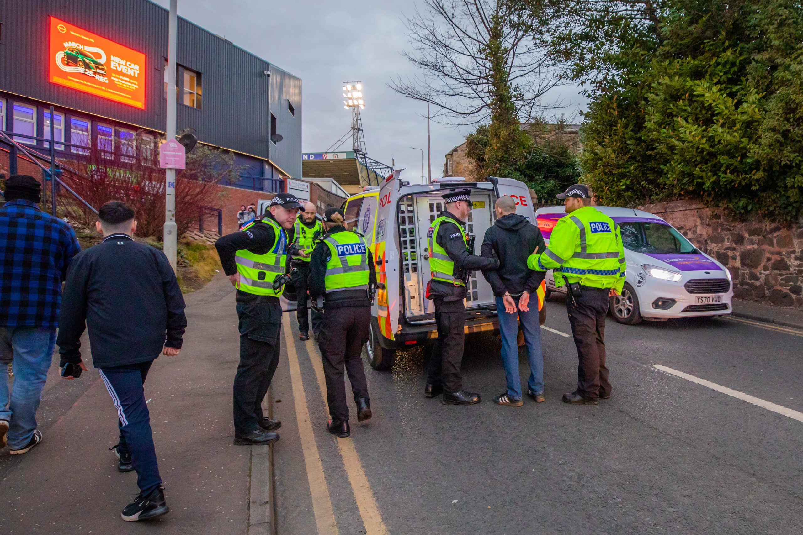 Youth apprehended by police at the ground.