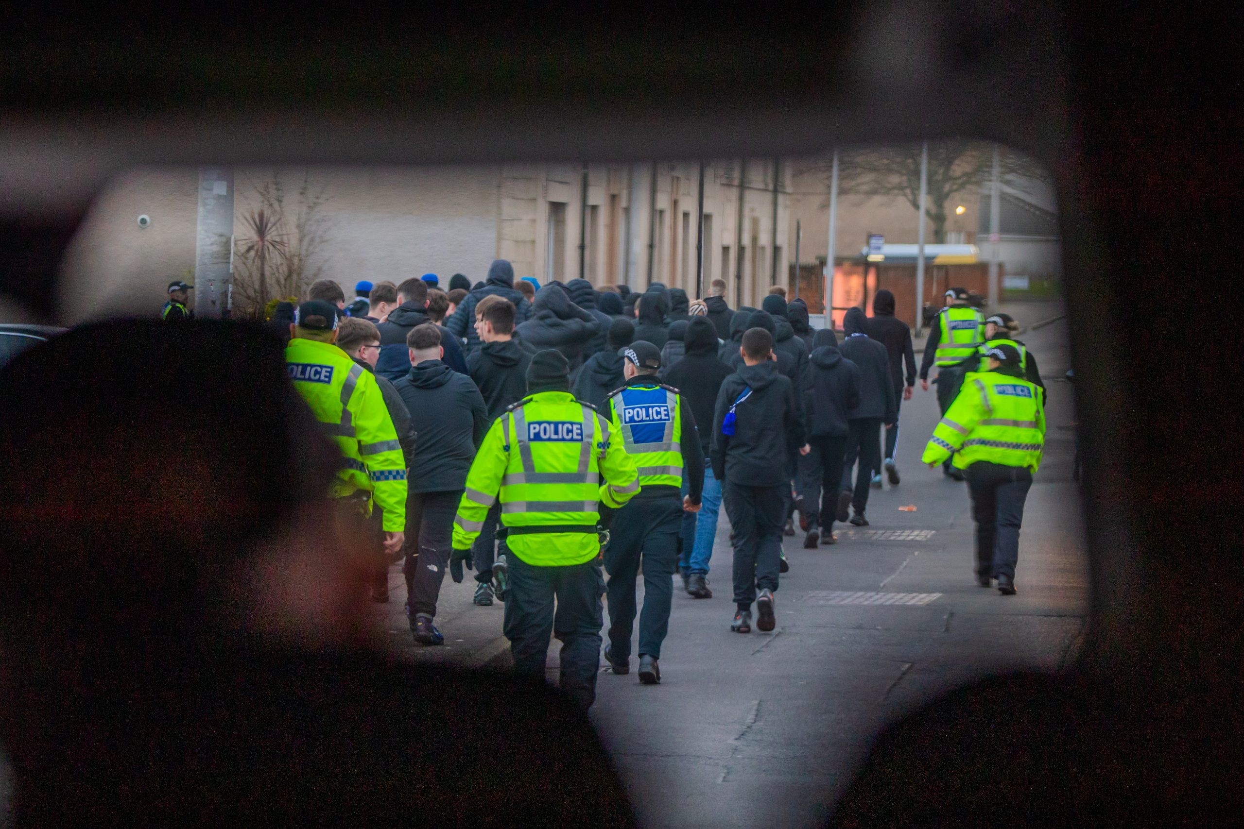 A group of young Raith Rovers fans escorted away from potential trouble.