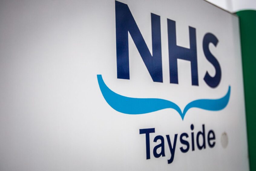 NHS Tayside logo on wall