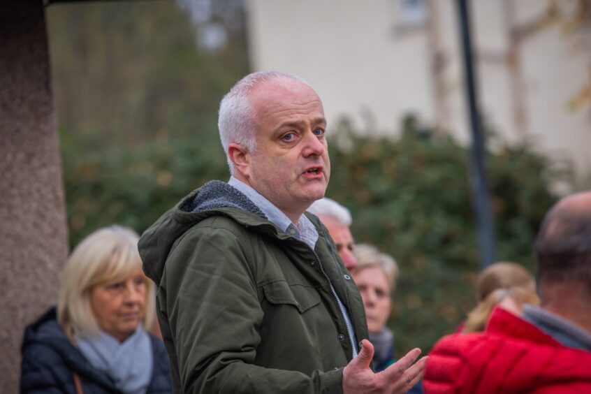 Mark Ruskell speaking to crowd at outdoors event