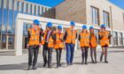 Greenfield Academy head teacher Johnny Lothian with some future pupils at the community entrance. Image: Steve MacDougall/DC Thomson.