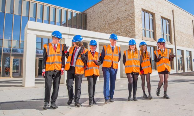 CR0052507 - Cheryl Peebles Story  - Dundee area - Tour of new Greenfield Academy site -   - Picture shows scenes from the tour, left to right is Braeview visitors Archie, Alfie, Kyle alongside Head Teacher Johnny Lothian with Craigie visitors Keevah, Ava and Louisa    --- Greenfield Academy and Drumgeith Community Campus, Drumgeith Road, Dundee -  Wednesday 19th March 2025  - Image: Steve MacDougall/DC Thomson